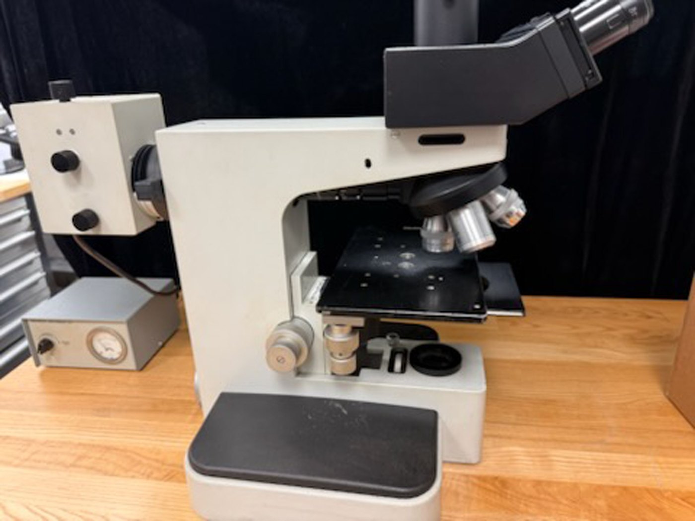 Leitz Metalloplan microscope seen from the side with its power supply